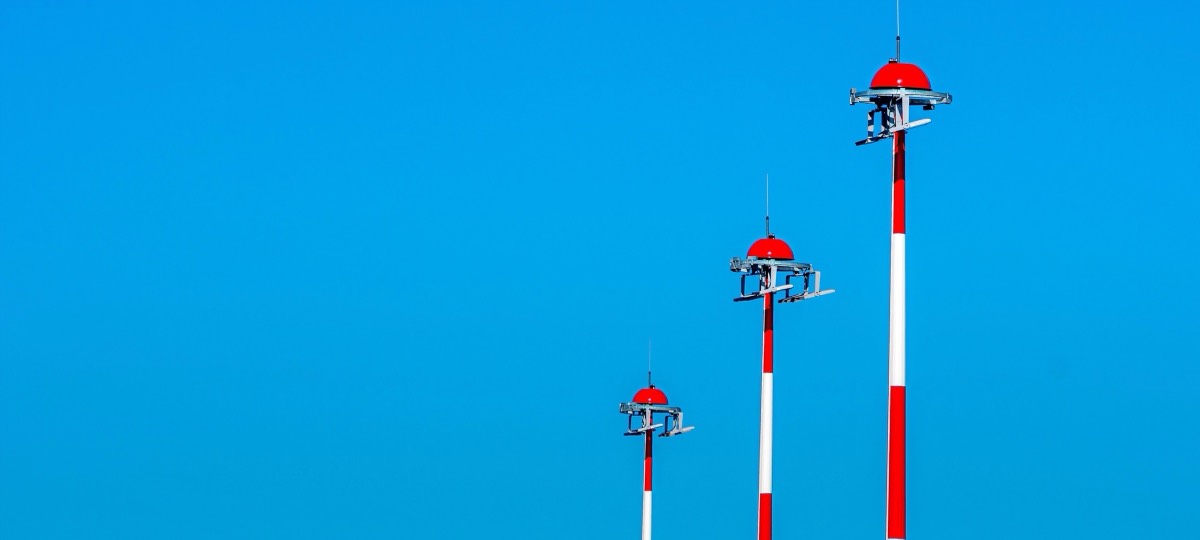Obstruction lit masts against a clear sky